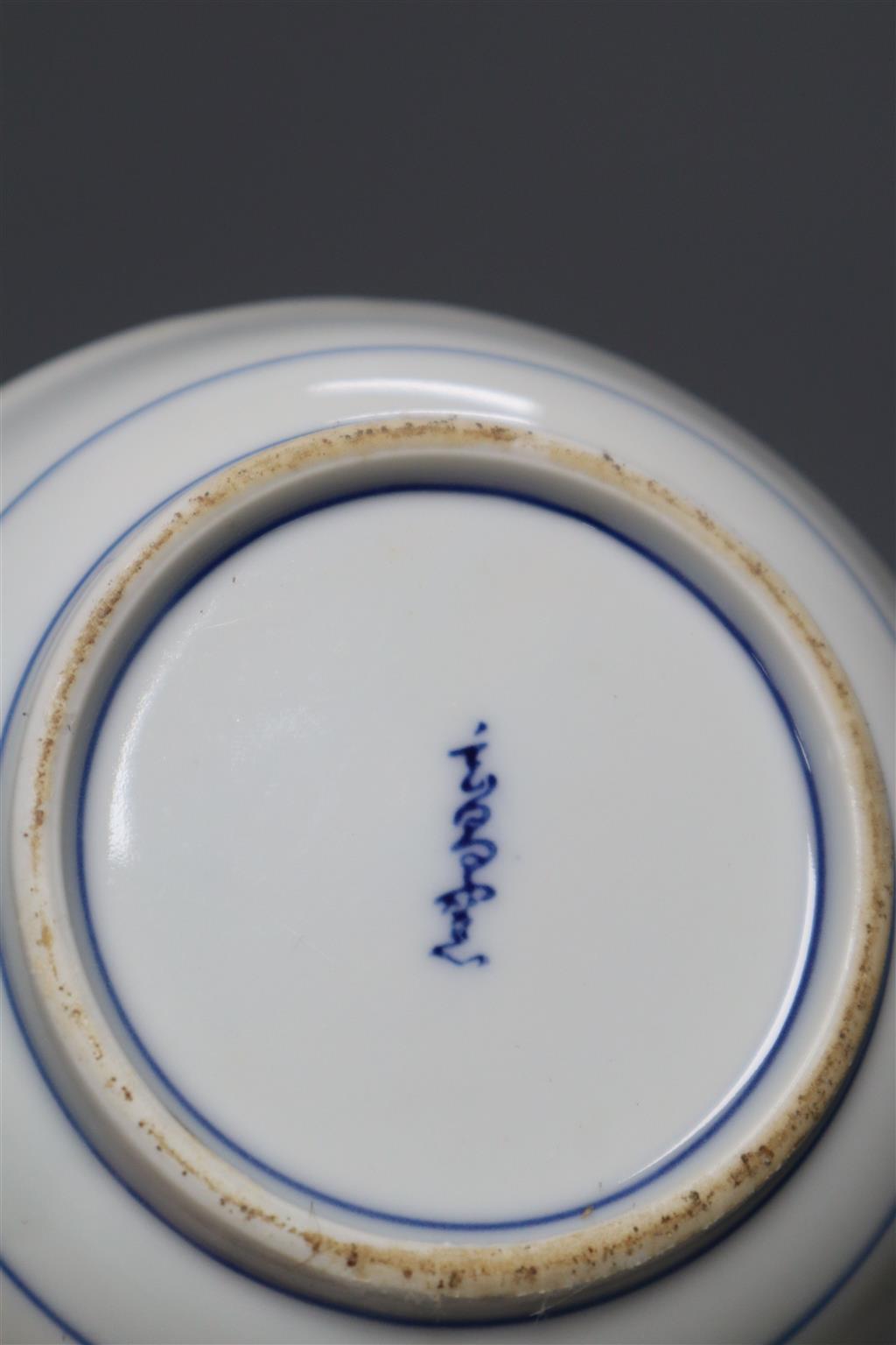 A graduated set of three Chinese porcelain blue and white bowls, largest 19cm and a group of four miniature Chinese blue and white vase